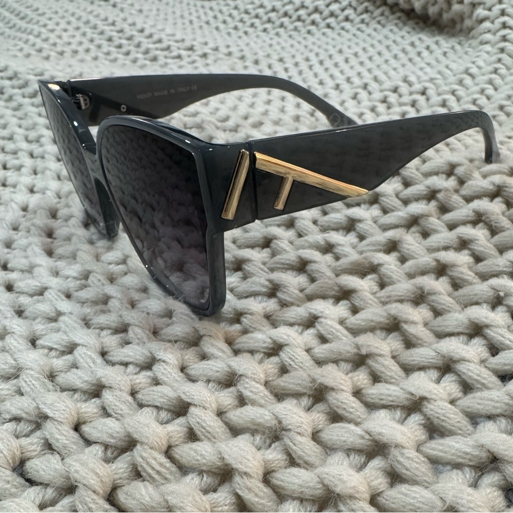 Fendi Elegant Black Sunglasses with Gold Detail